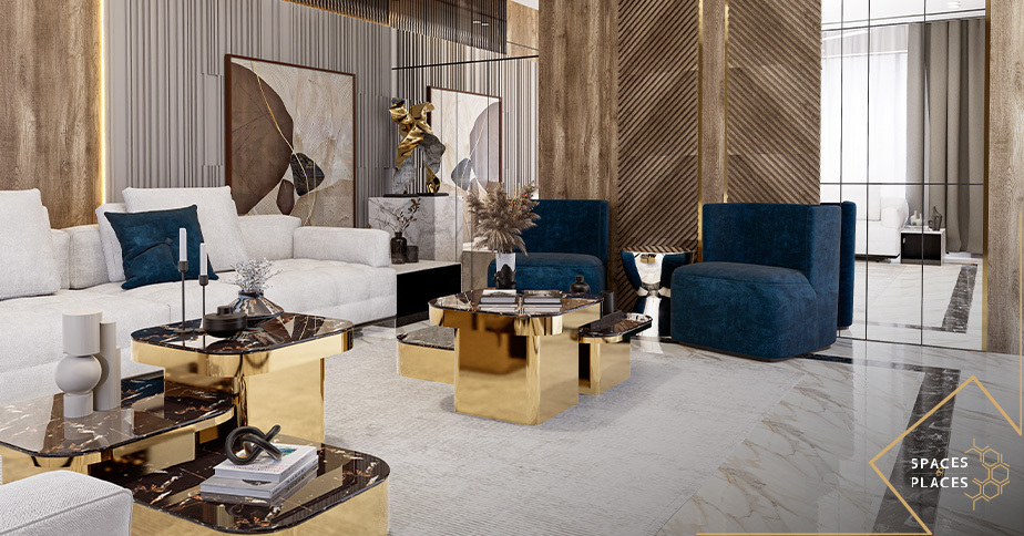 Contemporary living room with navy blue accent chairs, white sofas, and gold details